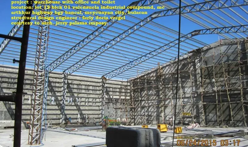 Steel roof framing of a warehouse with office, inside a half-built shell